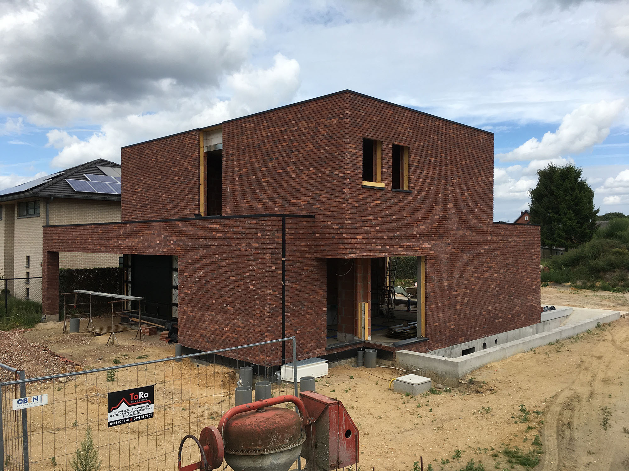 Tall slender porcelain bottle with natural clay textured body and cork stopper.