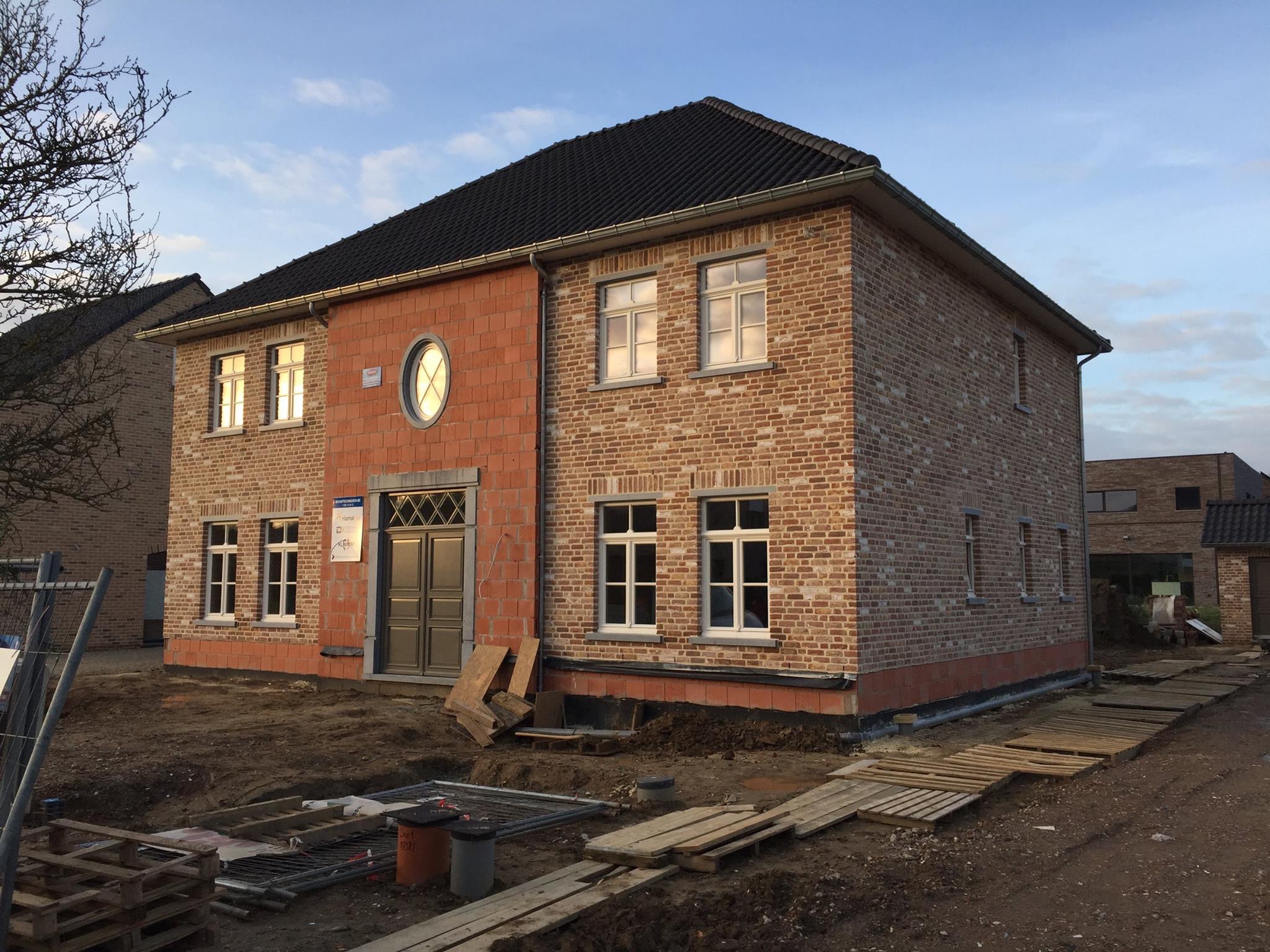 Tall slender porcelain bottle with natural clay textured body and cork stopper.