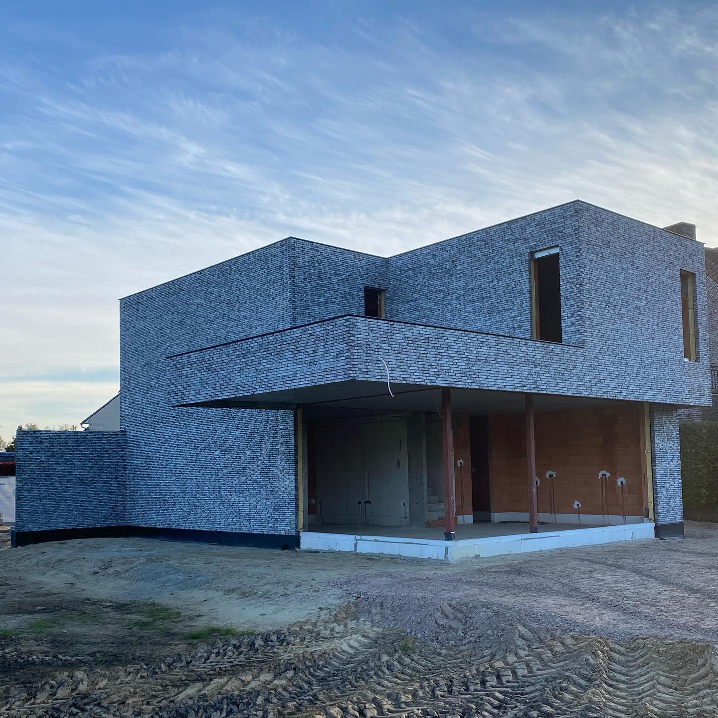 Tall slender porcelain bottle with natural clay textured body and cork stopper.